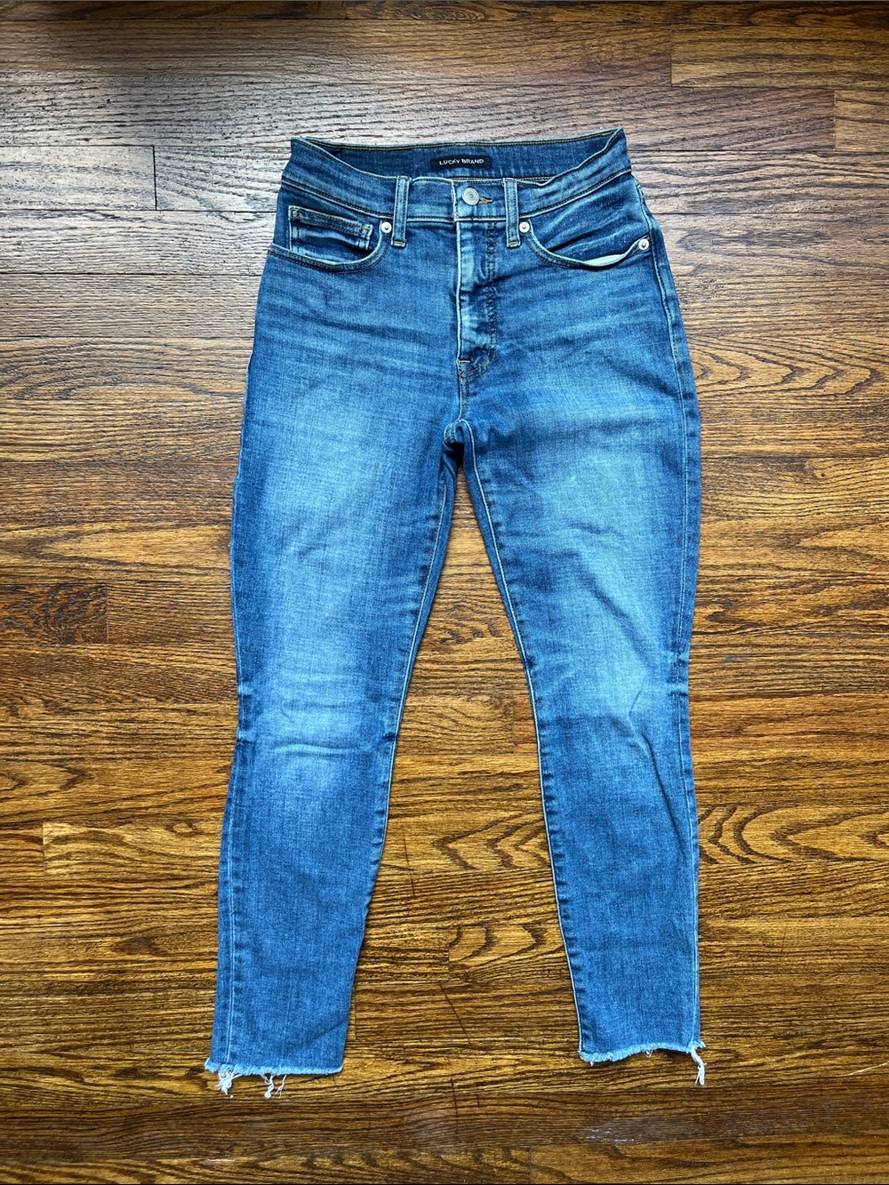 Lucky Brand medium blue skinny jeans with raw hem